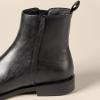 imageAmazon Essentials Womens Exterior Zip Flat Ankle BootBlack Faux Leather