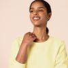 imageAmazon Essentials Womens Fleece Crewneck Long Sleeve Pullover Sweatshirt Available in Plus SizeLight Yellow