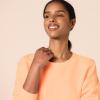 imageAmazon Essentials Womens Fleece Crewneck Long Sleeve Pullover Sweatshirt Available in Plus SizeMelon Orange