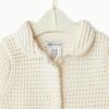 imageAmazon Essentials x Sofia Grainge Toddlers and Baby Girls Cotton Short Sleeve Button Front Sweater with Peter Pan CollarIvory