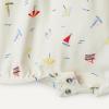 imageAmazon Essentials x Sofia Grainge Baby Girls Cotton Short Sleeve Romper with Peter Pan CollarSailboatsUneven Stripe
