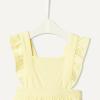 imageAmazon Essentials x Sofia Grainge Baby Girls Cotton Sleeveless Romper with RufflesLight Yellow