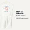 imageAmazon Essentials x Sofia Grainge Toddlers and Baby Girls Cotton Pique Short Sleeve TShirt amp Pants Play SetIvory Marine Club