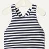 imageAmazon Essentials x Sofia Grainge Toddlers and Baby Girls OnePiece Swimsuit with Crisscross Straps Ruffle DetailIvory Navy Even Stripe
