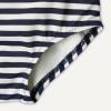 imageAmazon Essentials x Sofia Grainge Toddlers and Baby Girls OnePiece Swimsuit with Crisscross Straps Ruffle DetailIvory Navy Even Stripe