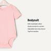 imageAmazon Essentials x Sofia Grainge Unisex Babies Short Sleeve Crewneck BodysuitDelicate FloralIvoryPink