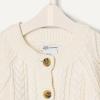 imageAmazon Essentials x Sofia Grainge Unisex Toddlers and Babies Cable Knit Fisherman Cardigan SweaterIvory