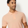 image:imageAmazon Essentials Mens SlimFit ShortSleeve Cotton Pique Polo ShirtPale Peach